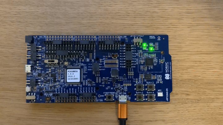 A Nordic nRF52840 development kit lit up during FIDO authentication